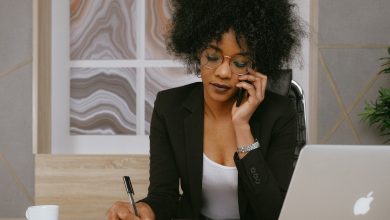 woman-in-black-blazer-holding-smartphone