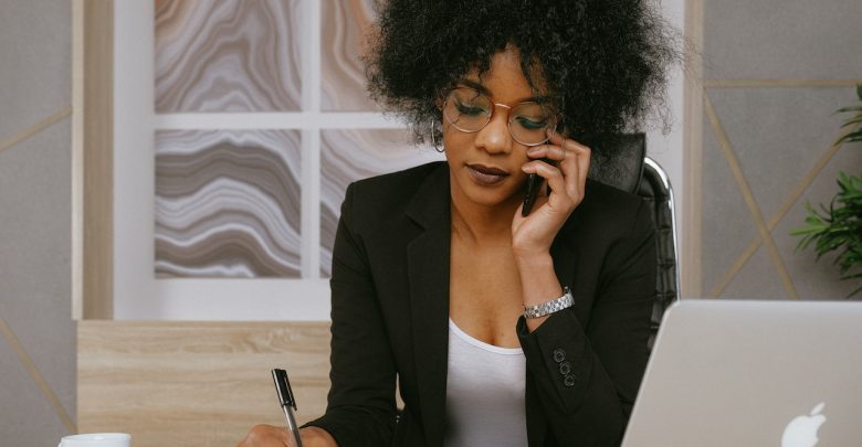 woman-in-black-blazer-holding-smartphone